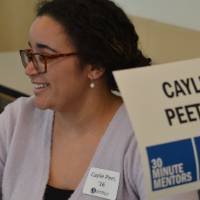Caylie Peet smiling while talking with students at the 30 Minute Mentors Event